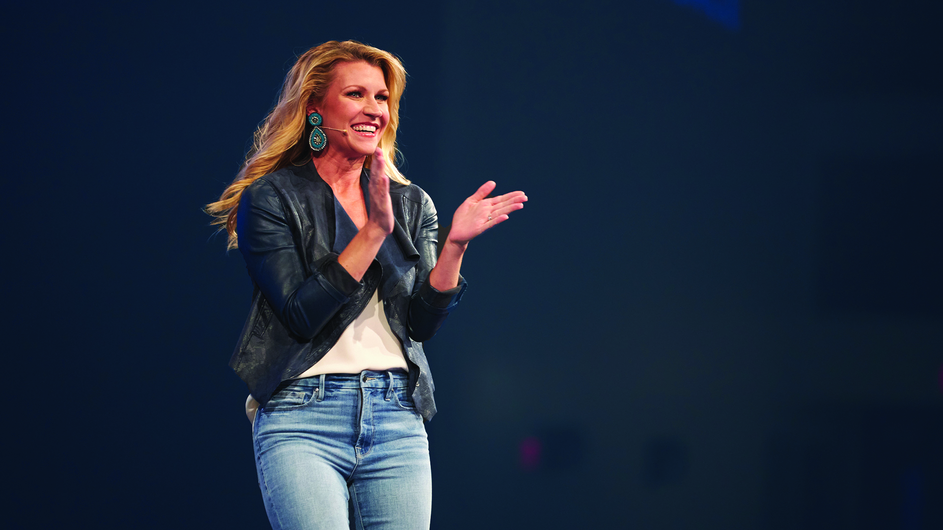 Christy Wright speaking on stage about confidence