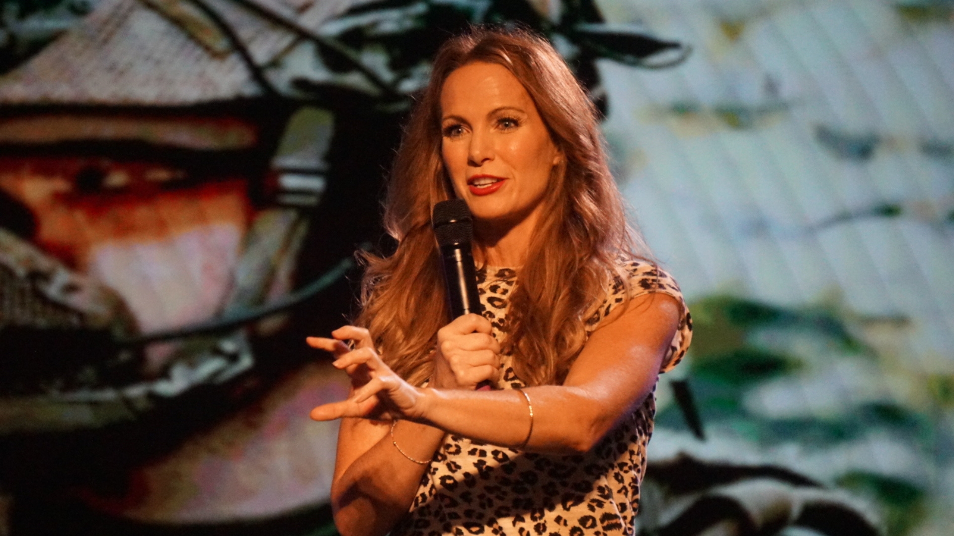 Dr. Shannan Crawford speaking on stage about anxiety