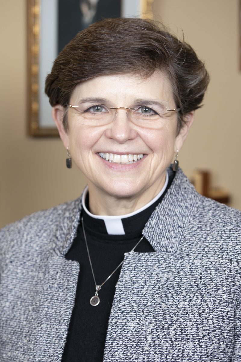 Rev. Dr. Margaret Grun Kibben smiling at the camera