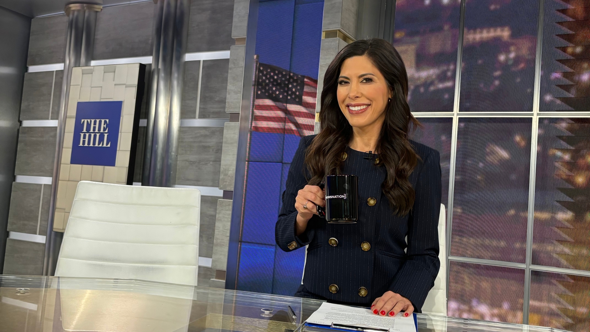 Denise Grace Gitsham on a news set discussing storytelling