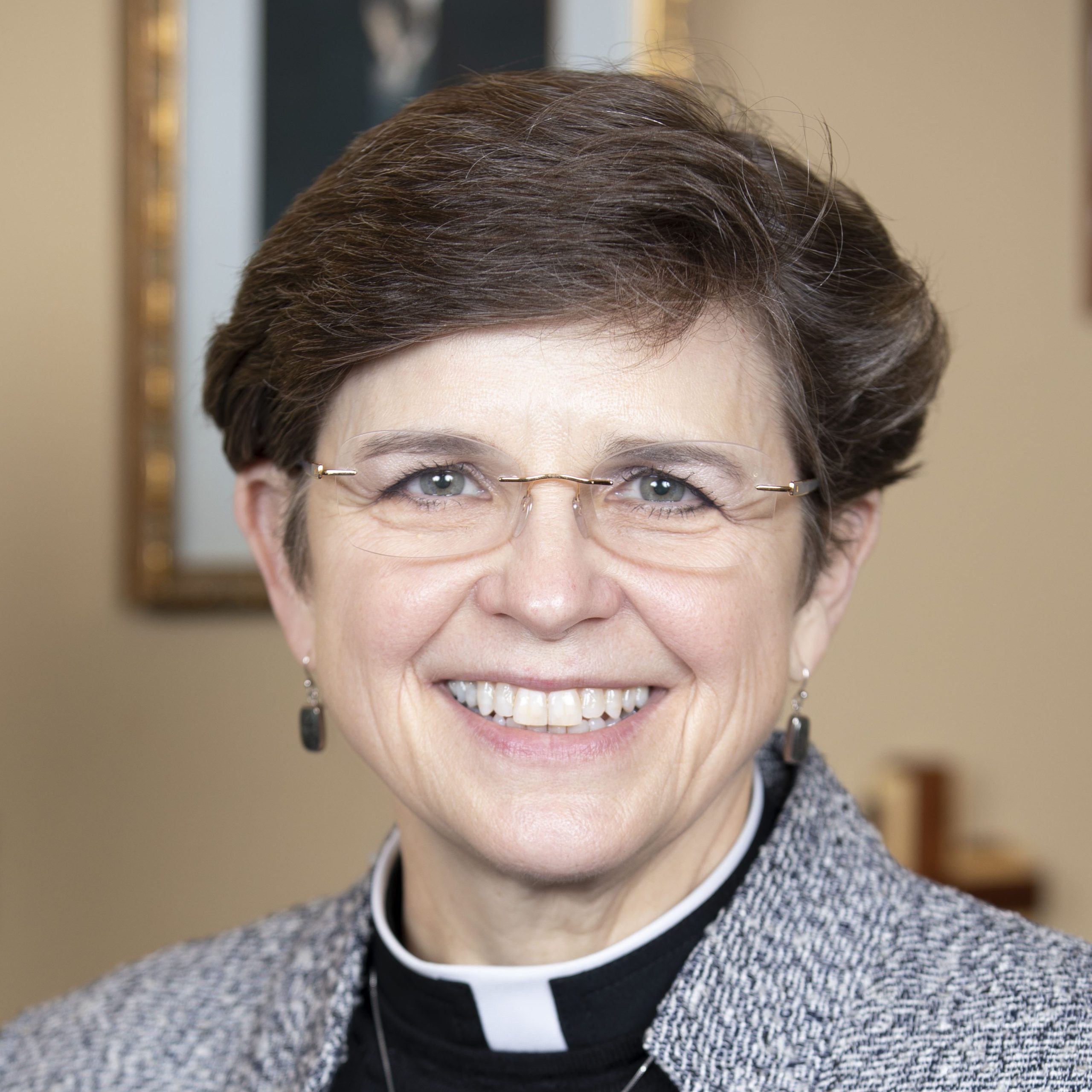 Rev. Dr. Margaret Grun Kibben smiling at the camera
